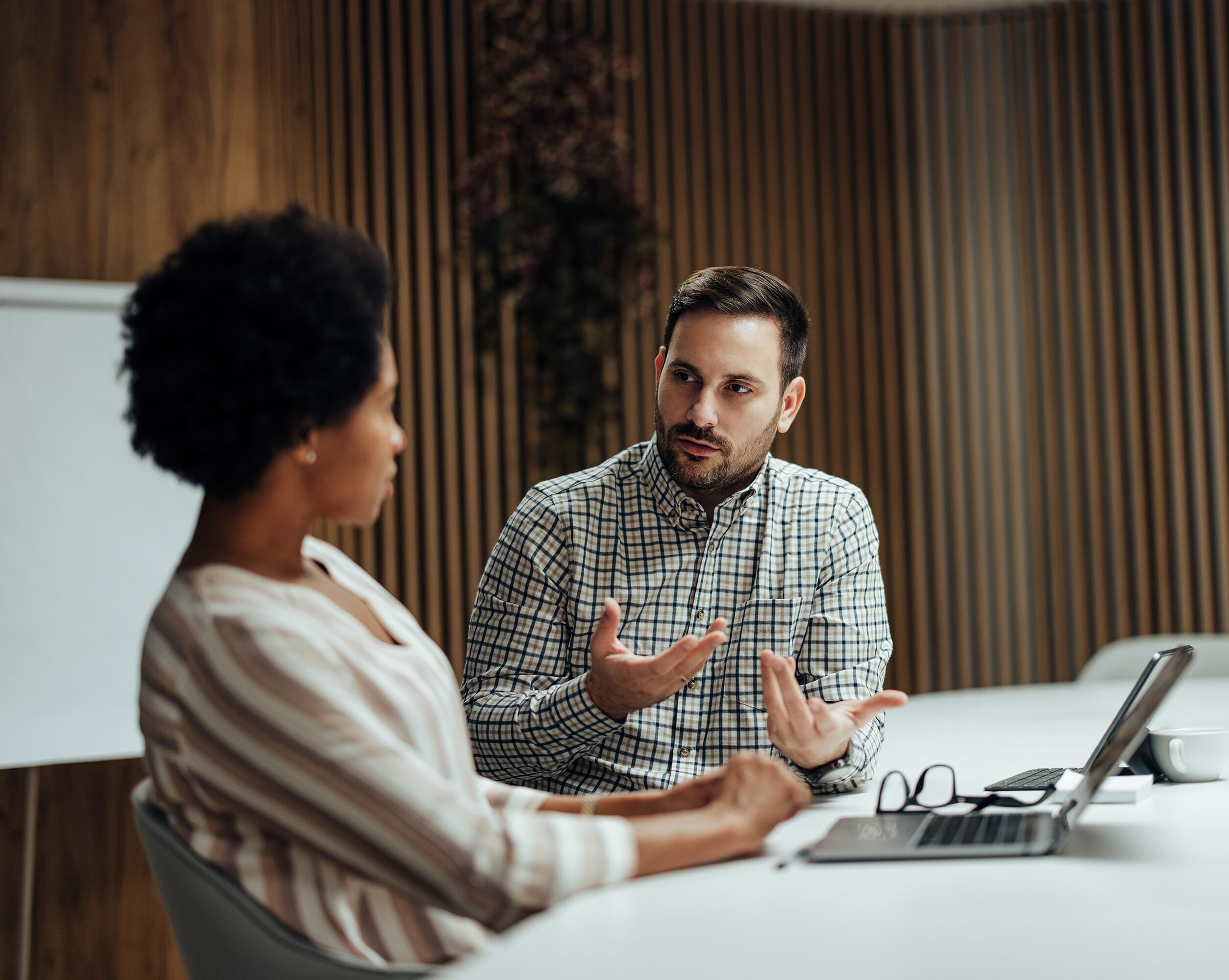 A-man-discussing-whats-changed-with-a-client
